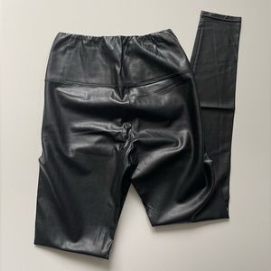 Wilfred Free vegan leather leggings in black.